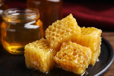 Composition with fresh honey on slate board, closeup