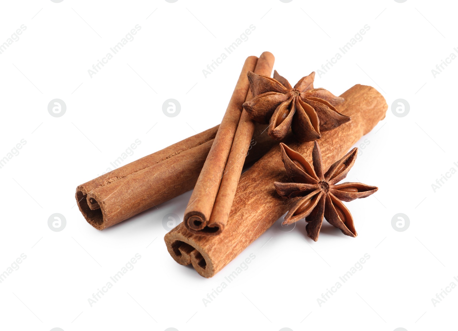 Photo of Cinnamon sticks and anise stars isolated on white