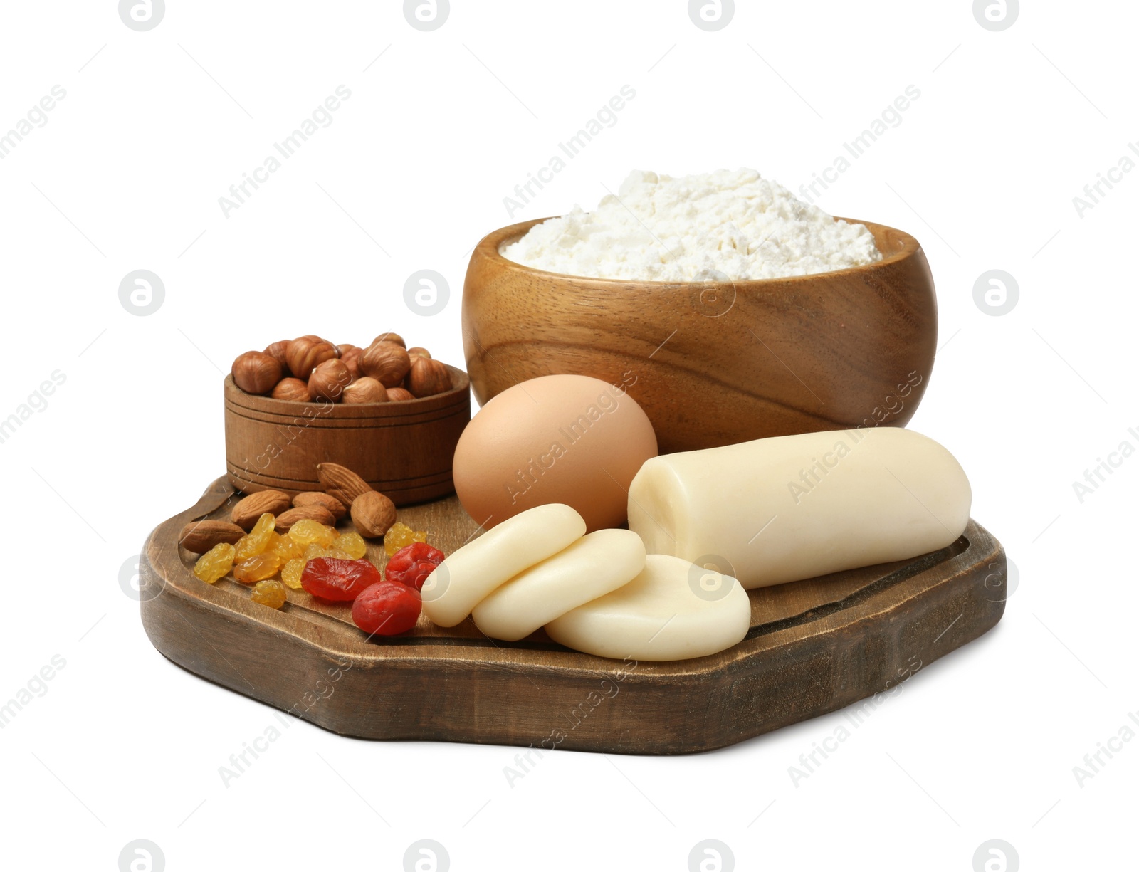 Photo of Marzipan and other ingredients for homemade Stollen on white background. Baking traditional German Christmas bread