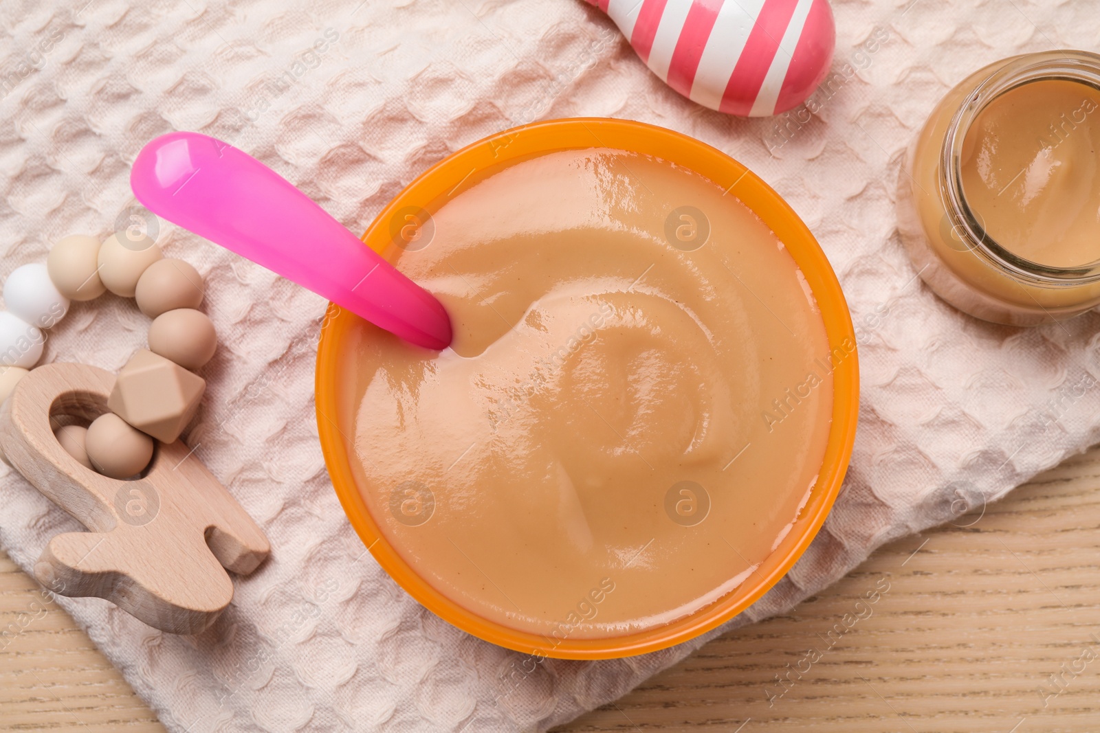 Photo of Flat lay composition with healthy baby food on wooden table