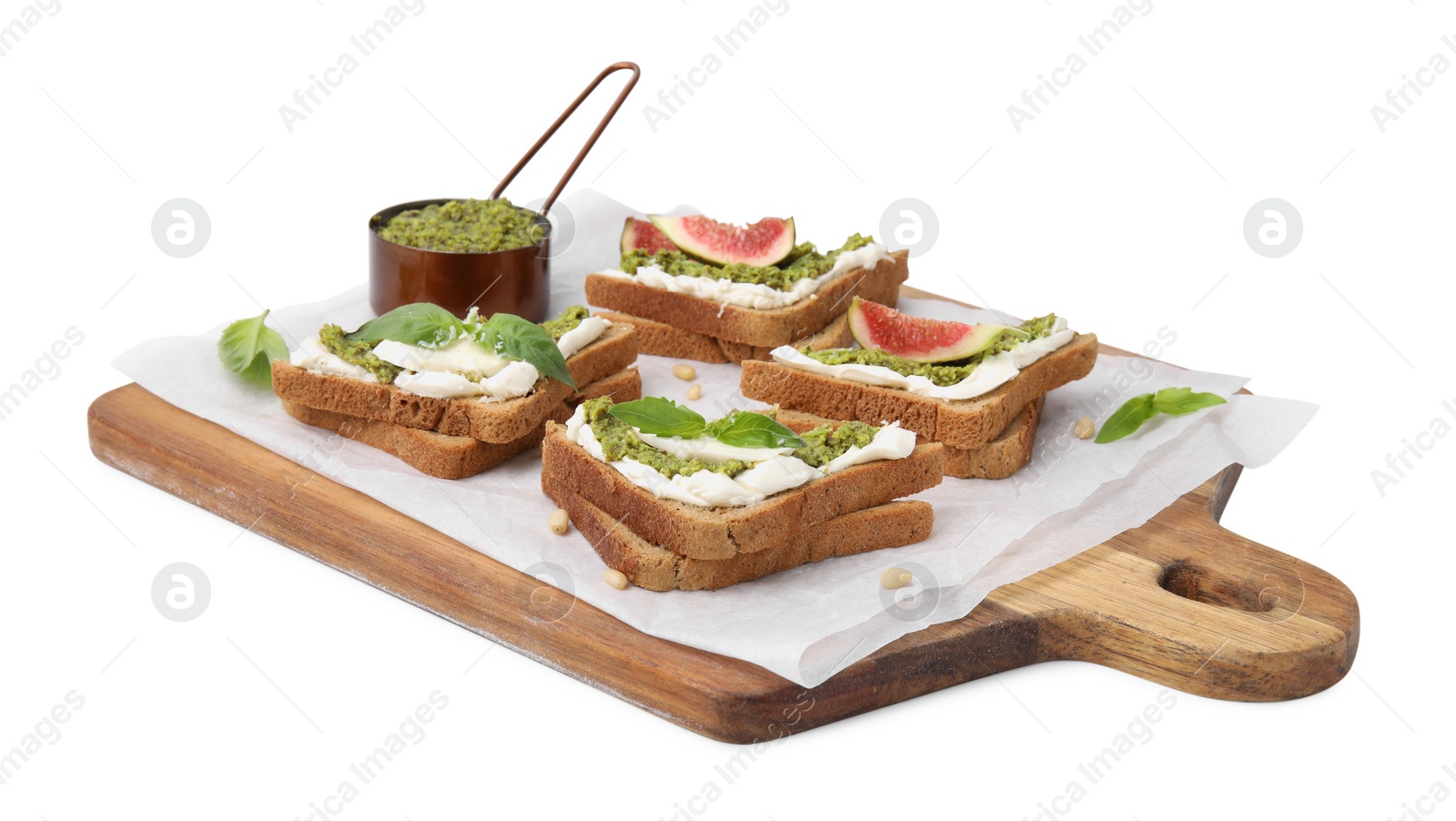 Photo of Tasty bruschettas with cream cheese, pesto sauce and fresh basil on white background