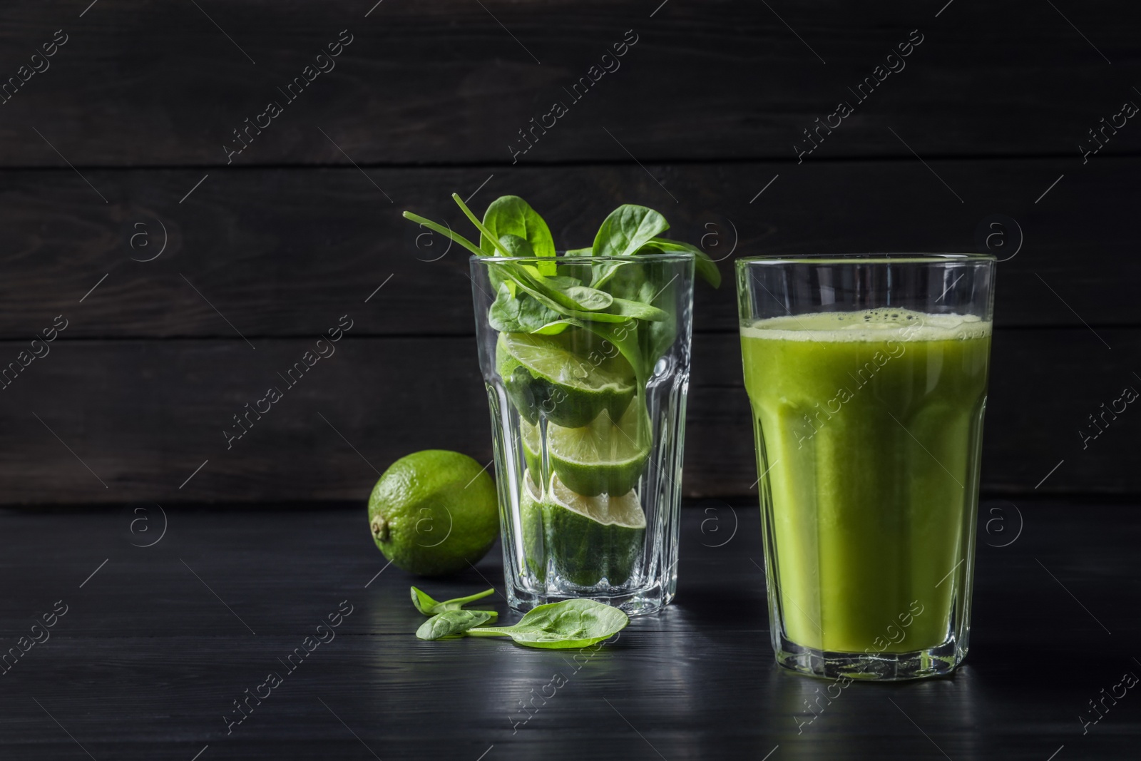 Photo of Glasses with delicious detox juice and ingredients on table