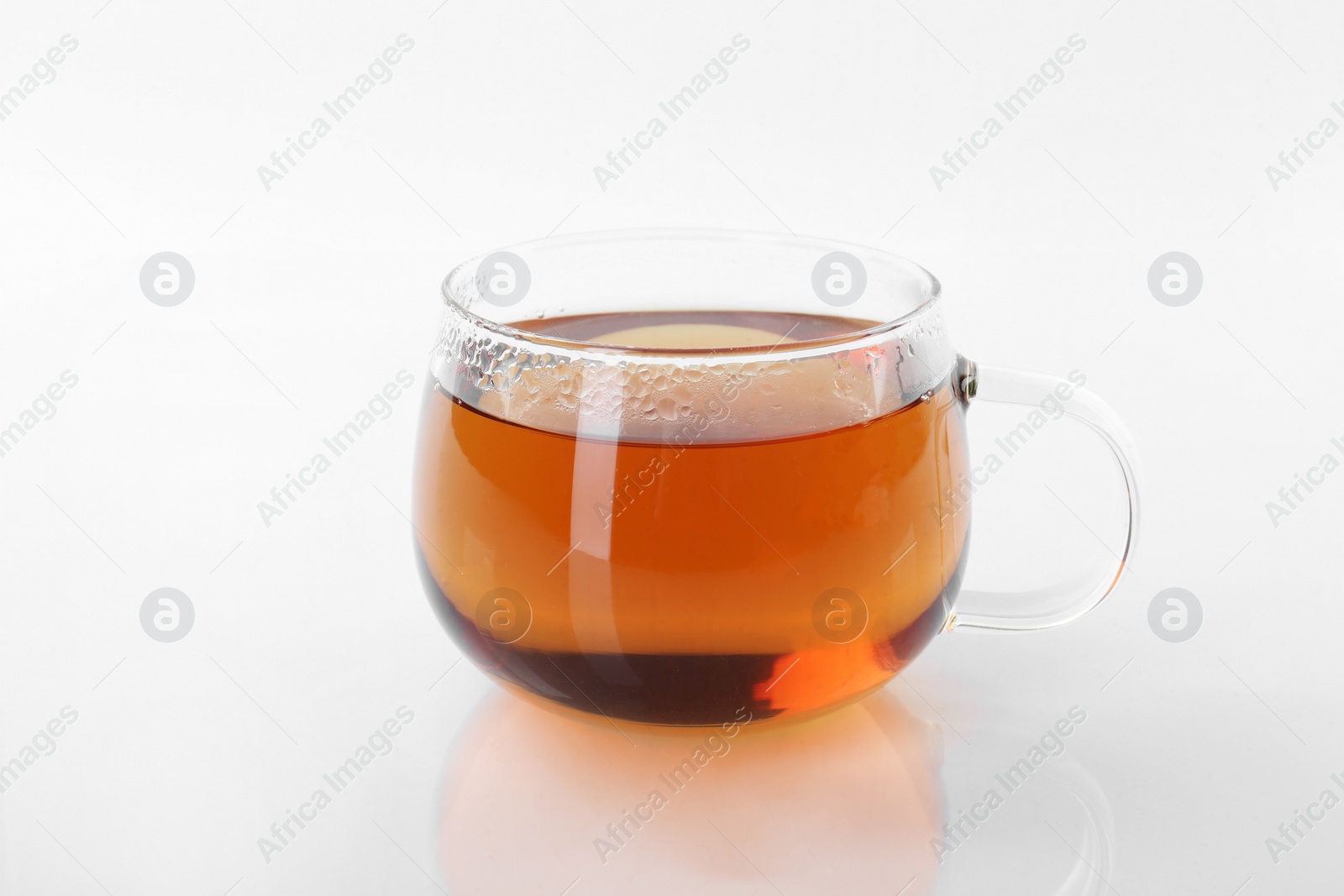 Photo of Tasty tea in cup on white background