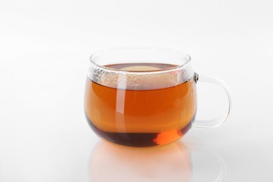 Tasty tea in cup on white background