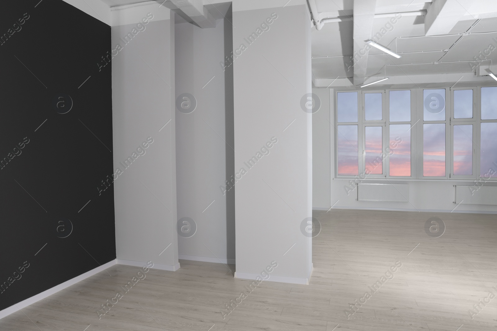 Photo of New empty room with clean windows and color walls