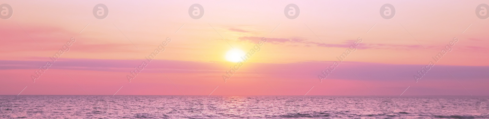 Image of Beautiful panorama of sky over sea at sunset. Banner design