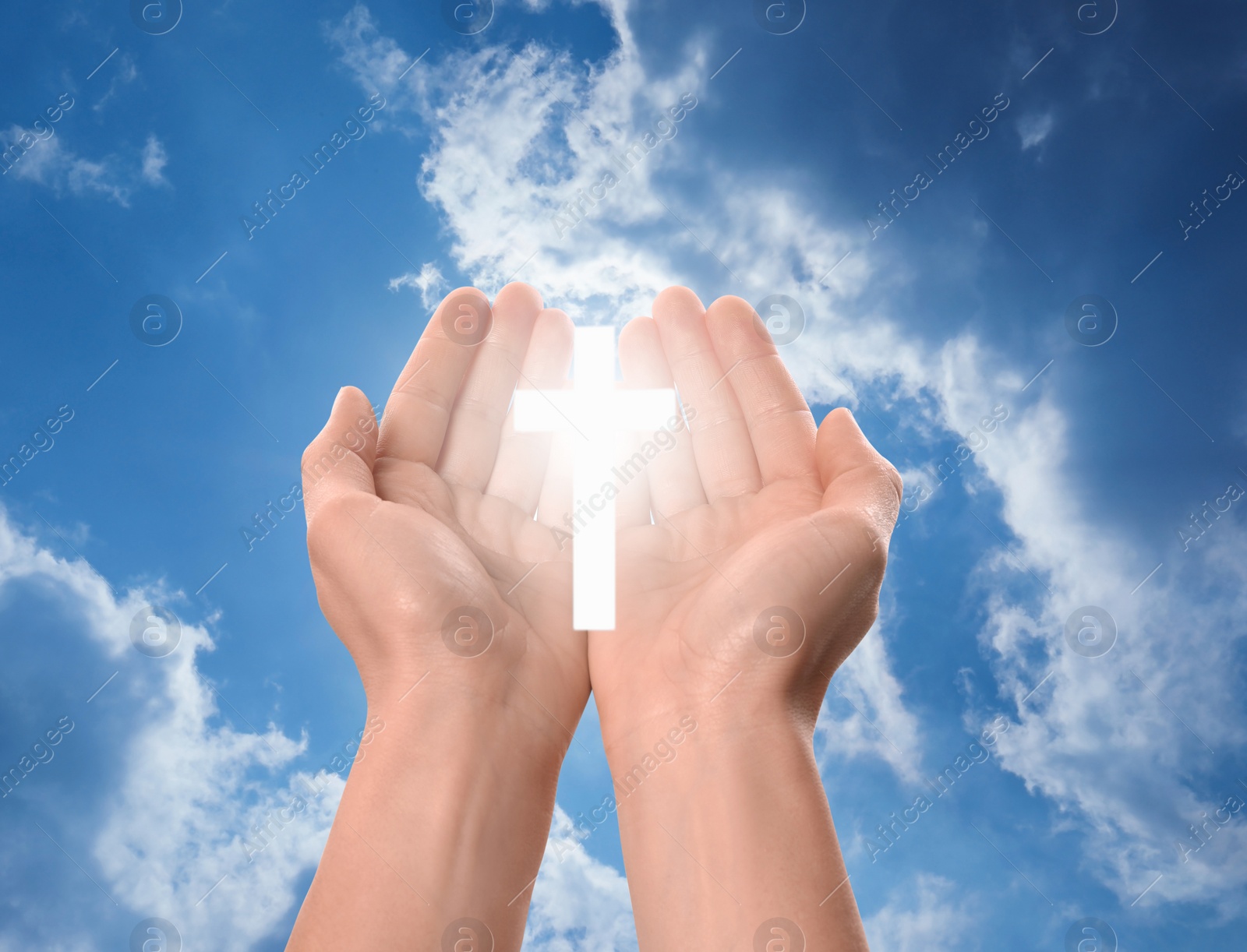 Image of Religion. Christian woman with glowing cross praying against sky, closeup