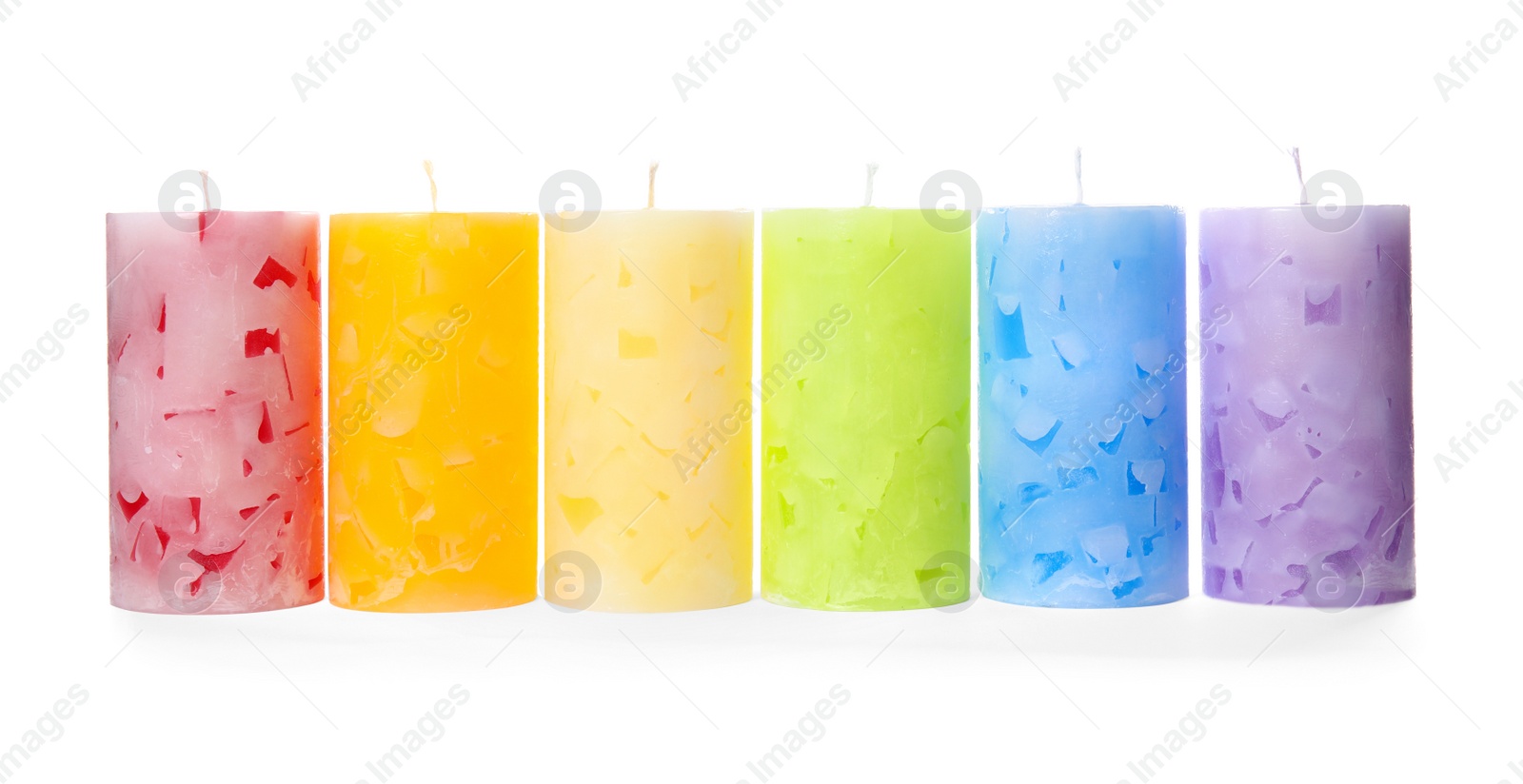 Photo of Six color wax candles on white background