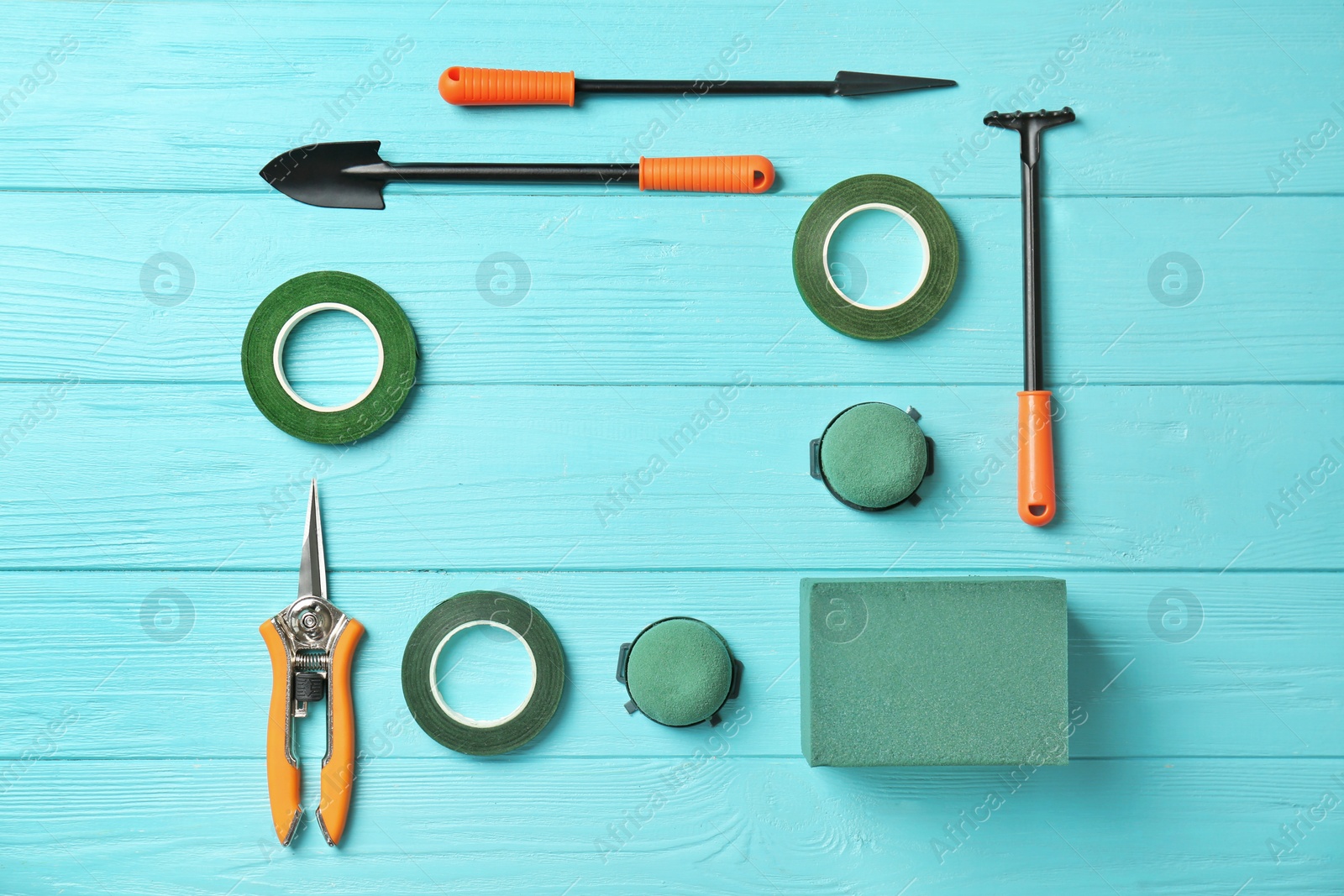 Photo of Florist equipment on wooden background, top view