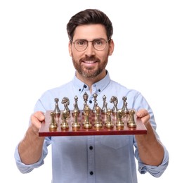 Photo of Smiling man holding chessboard with game pieces on white background