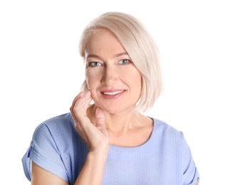 Portrait of charming mature woman with healthy beautiful face skin and natural makeup on white background