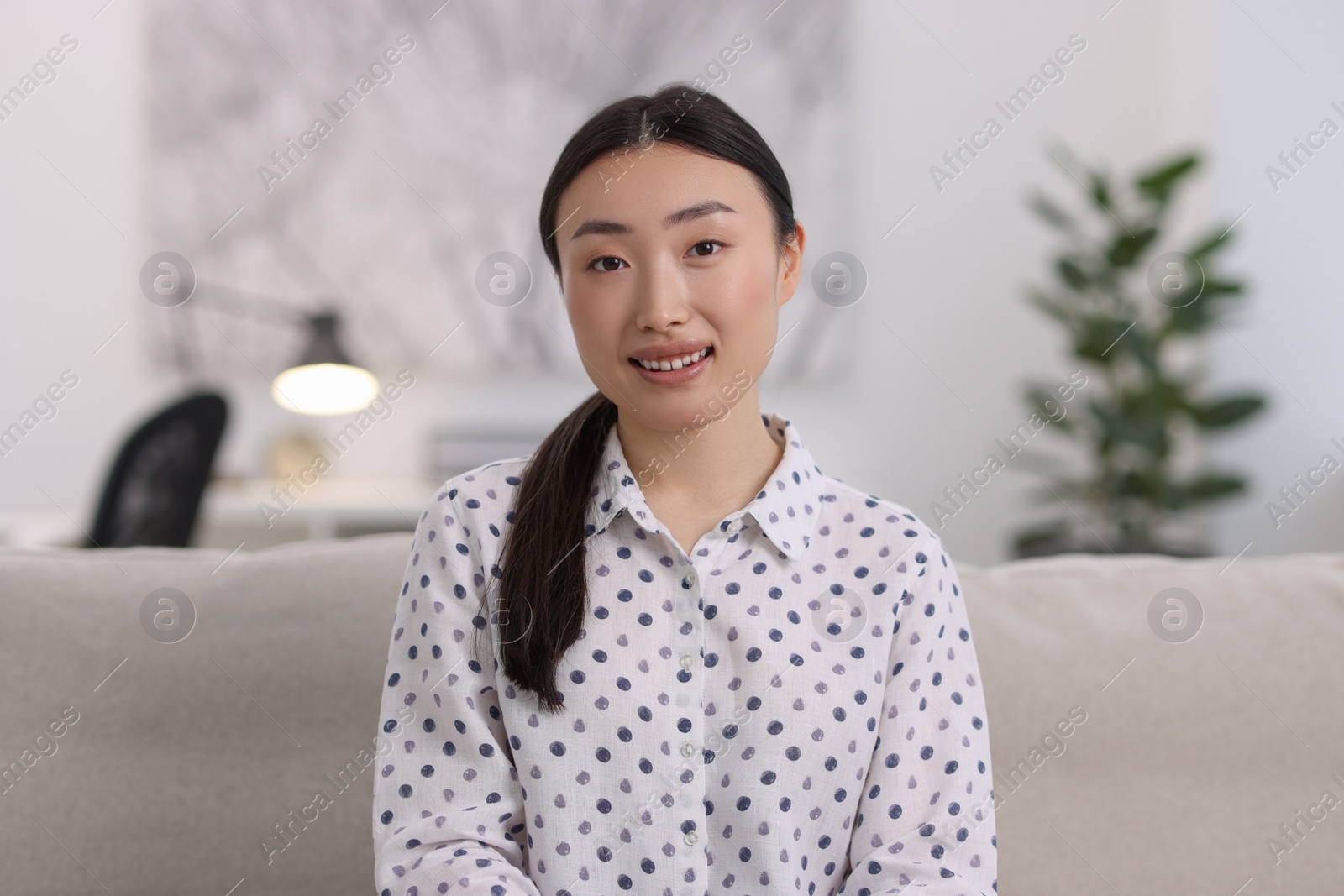 Photo of Portrait of smiling businesswoman wearing shirt in office