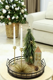 Beautiful Christmas composition with burning candles on table indoors