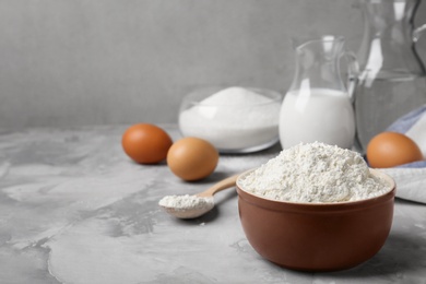 Photo of Bowl with flour on table