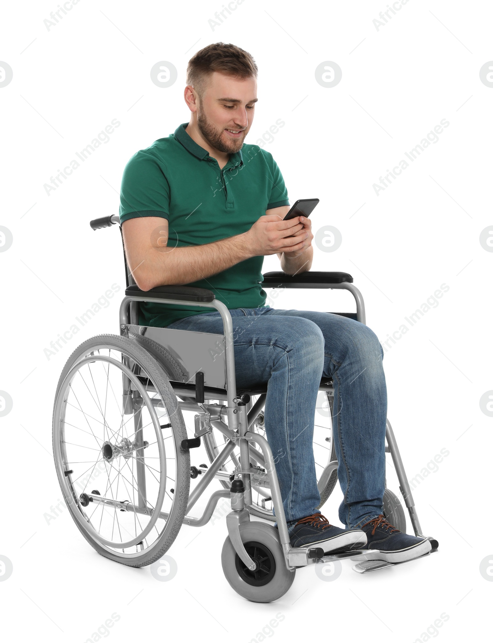 Photo of Young man in wheelchair with mobile phone isolated on white