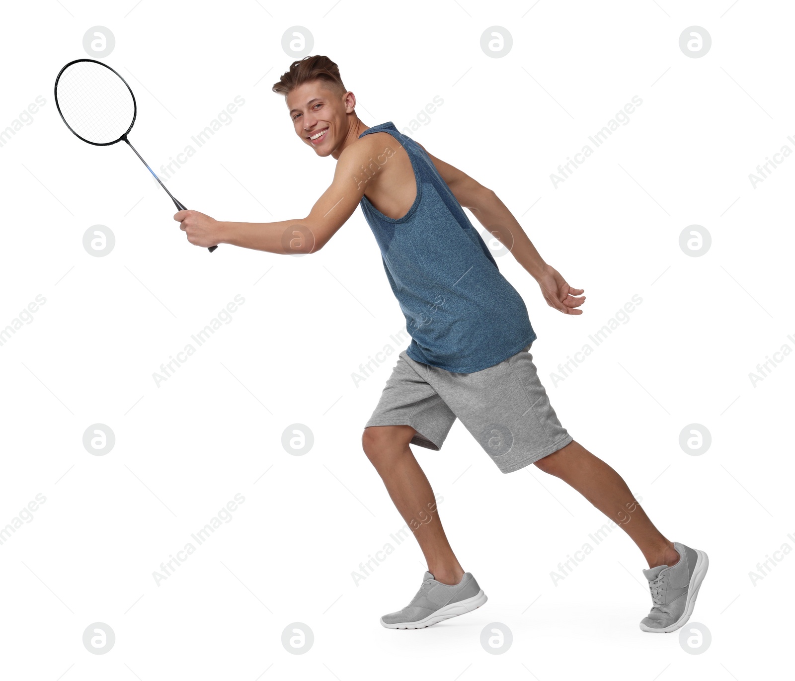 Photo of Young man playing badminton with racket on white background