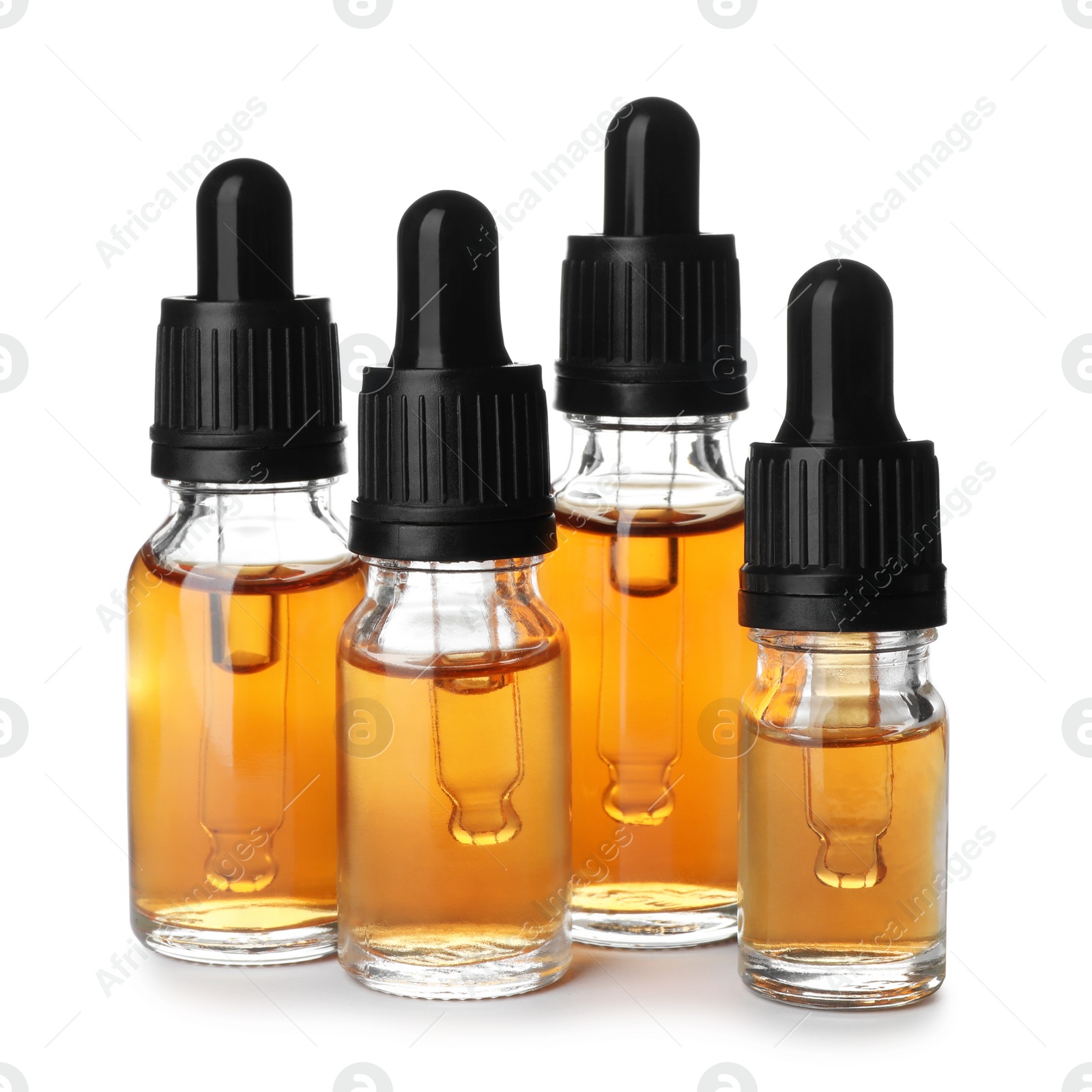 Photo of Bottles of essential oil isolated on white