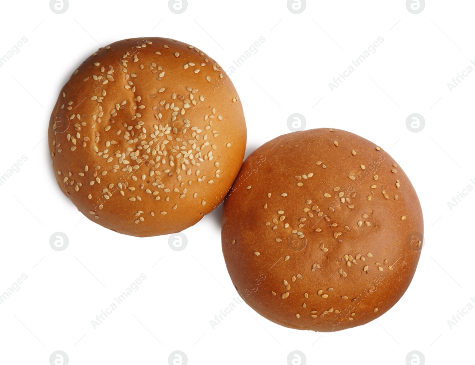 Photo of Fresh tasty buns with sesame seeds isolated on white, top view