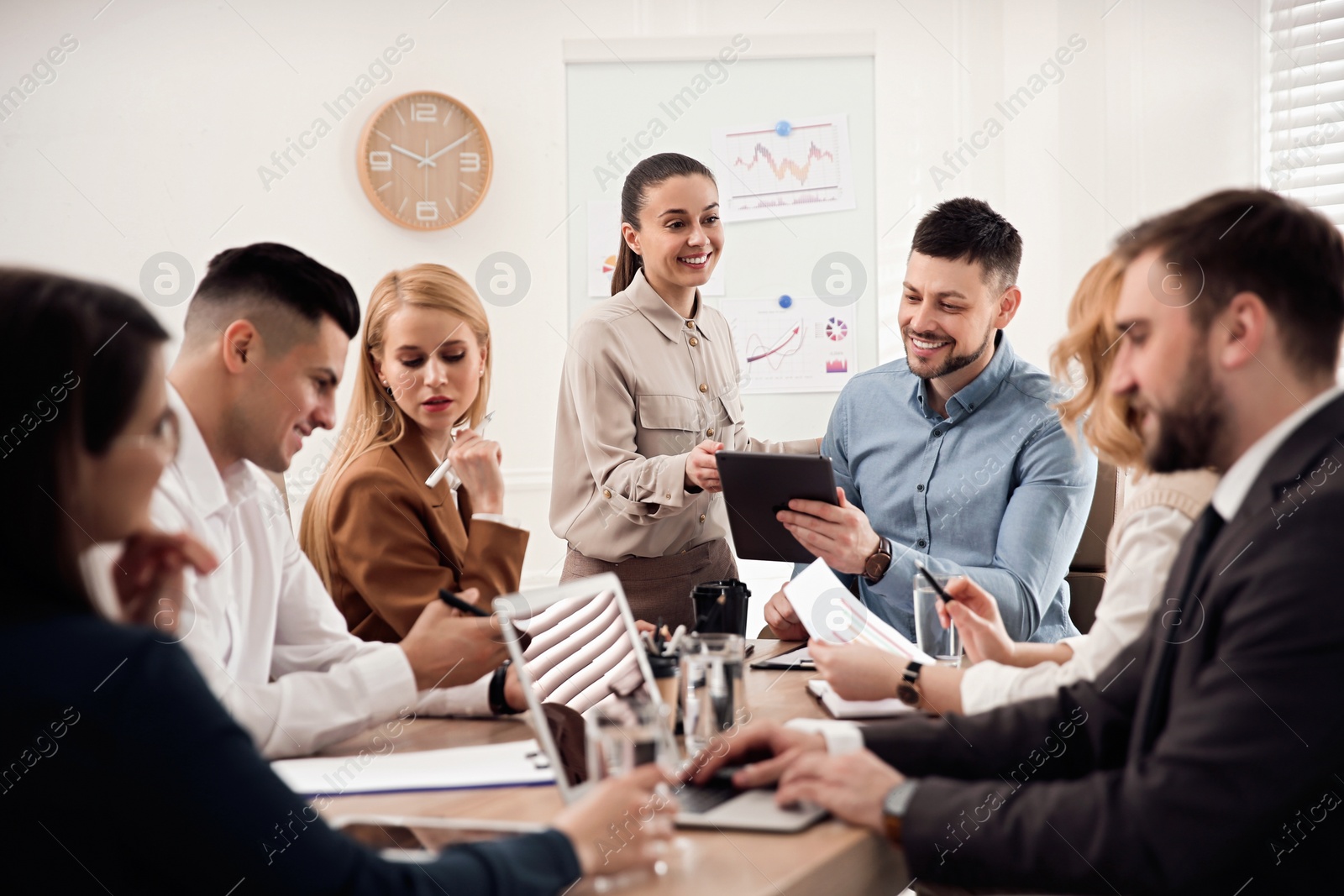 Photo of Businesspeople having meeting in office. Management consulting