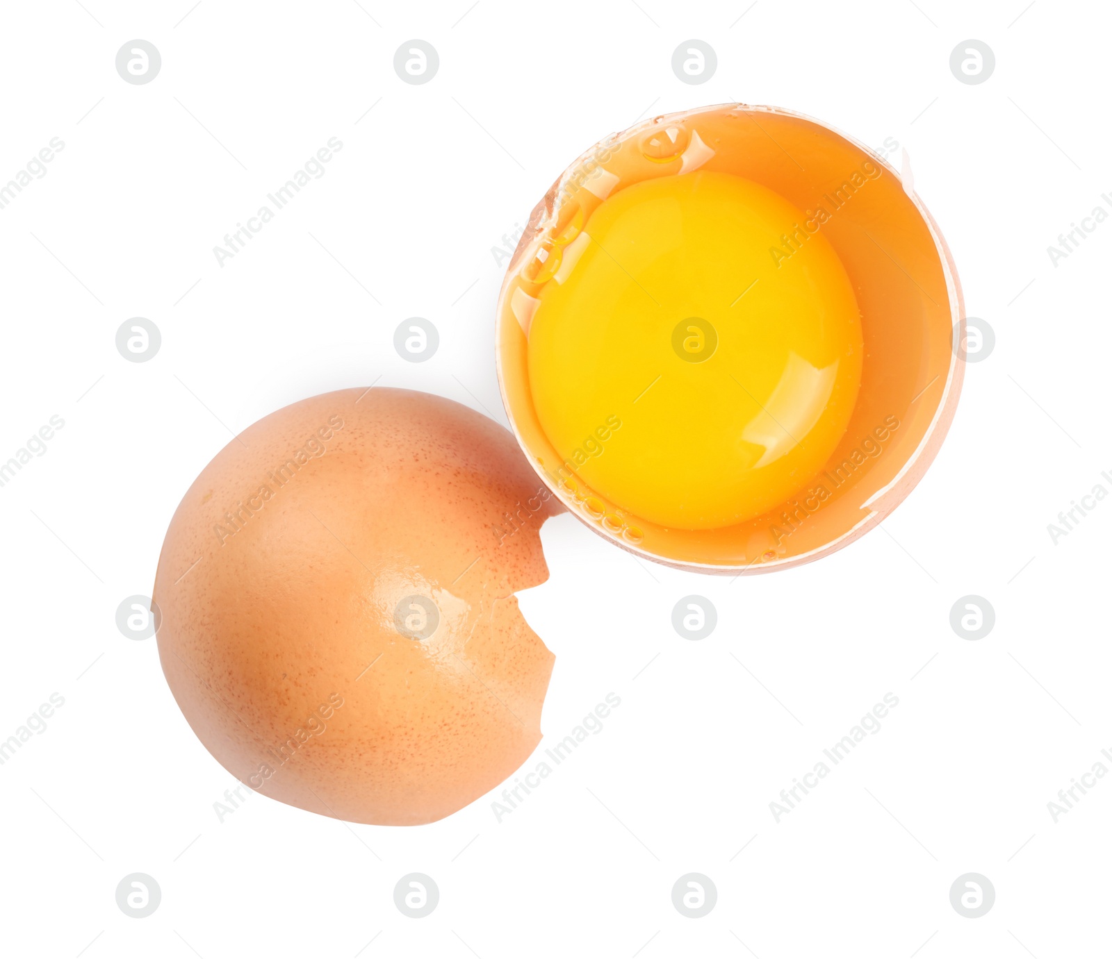 Photo of Cracked chicken egg with yolk isolated on white, top view