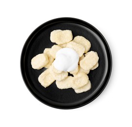Plate of tasty lazy dumplings with sour cream isolated on white, top view