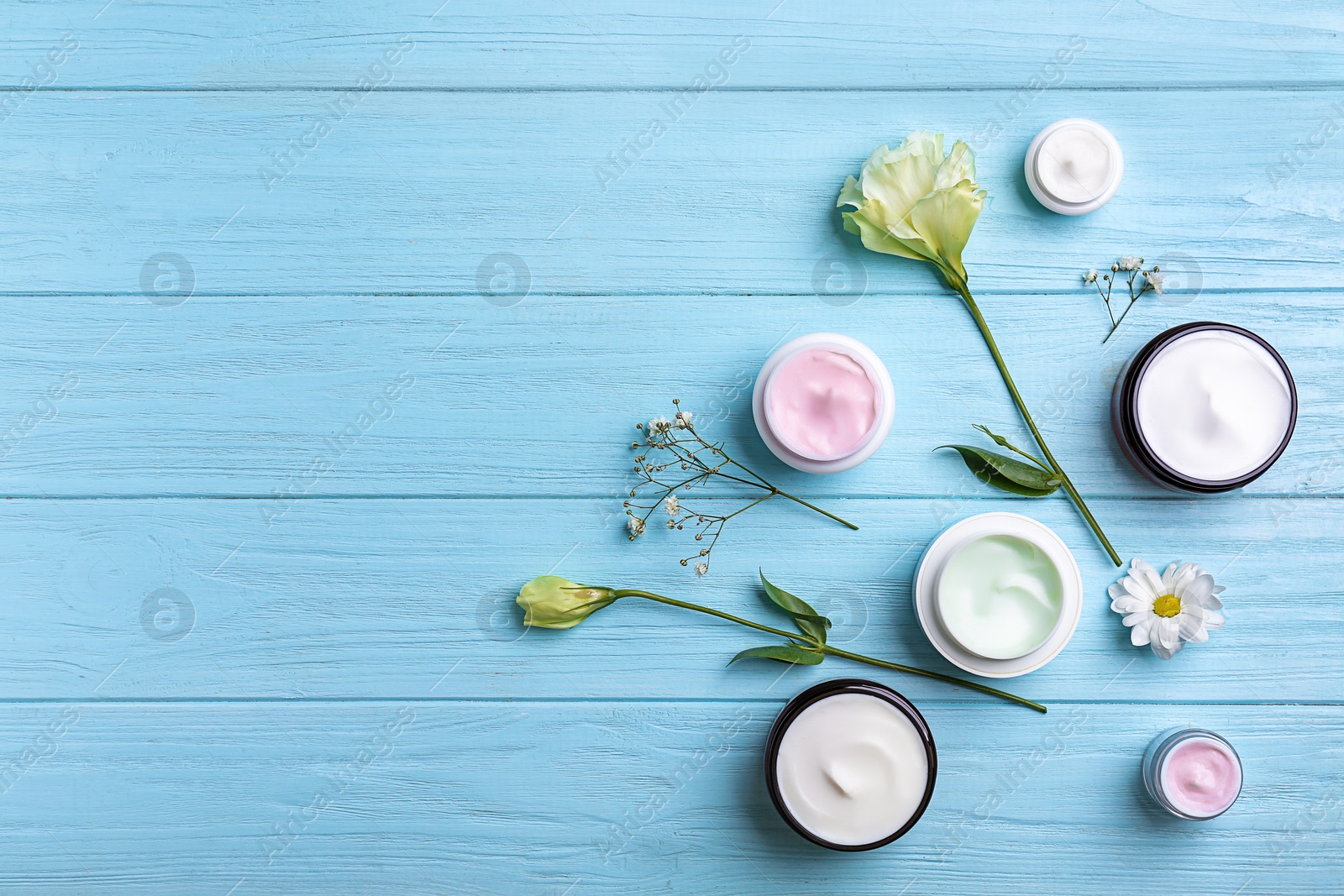 Photo of Composition with body cream on wooden background