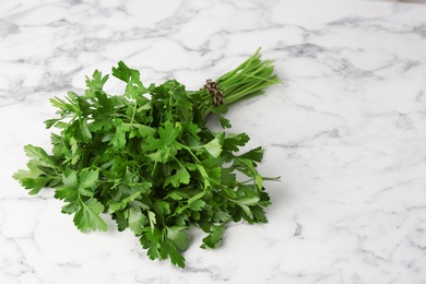 Bunch of fresh green parsley on marble background