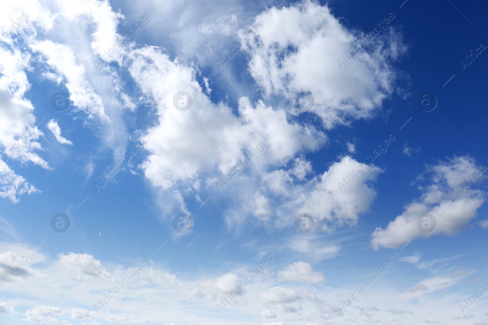 Photo of Picturesque blue sky with white clouds on sunny day