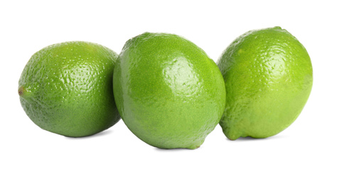 Fresh green ripe limes isolated on white