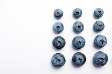 Flat lay composition with tasty blueberry and space for text on white background