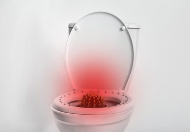 Image of Hemorrhoid concept. Toilet bowl with pins and cactus on white background