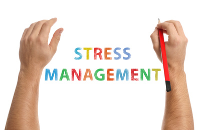 Man writing text STRESS MANAGEMENT on white background, closeup