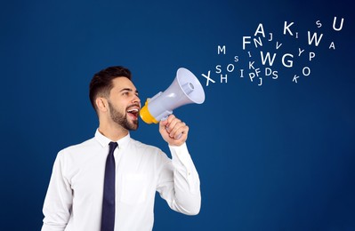 Image of Man using megaphone on blue background. Letters flying out of device