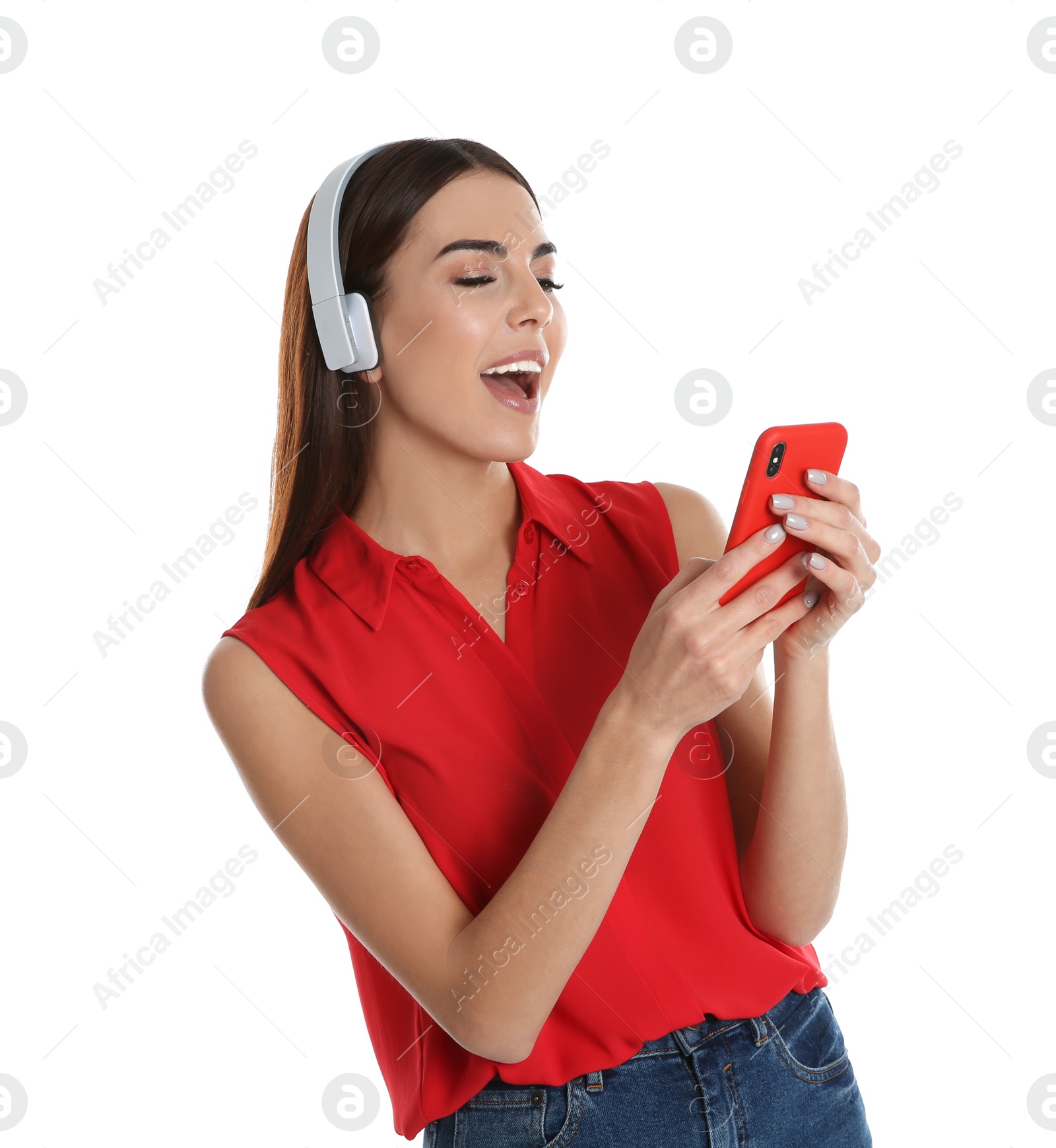 Photo of Beautiful young woman listening to music with headphones on white background