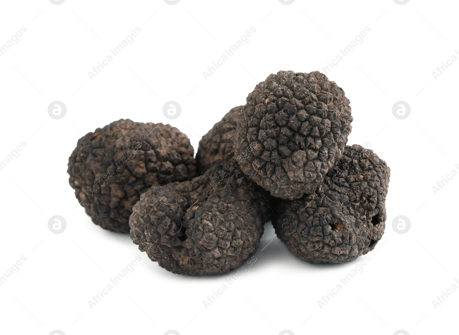 Photo of Fresh whole black truffles isolated on white