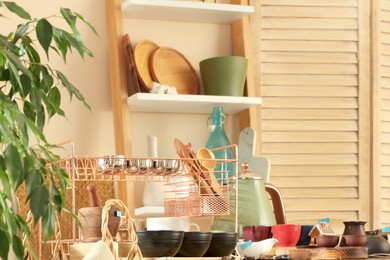 Photo of Many different cooking utensils in room. Garage sale