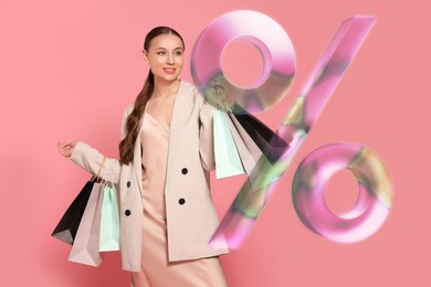 Image of Discount offer. Happy woman with paper shopping bags looking at illustration of percent sign on pink background