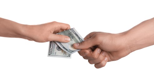 Photo of Money exchange. Man giving dollar banknote to woman on white background, closeup