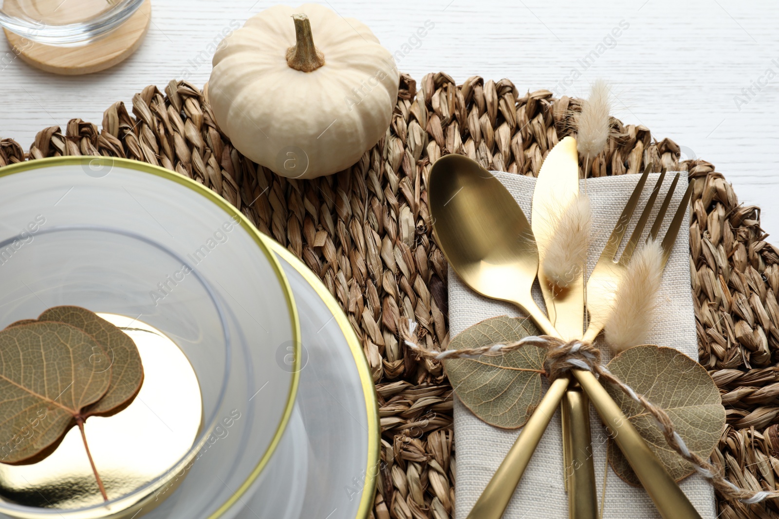 Photo of Autumn table setting and pumpkin on white background, closeup