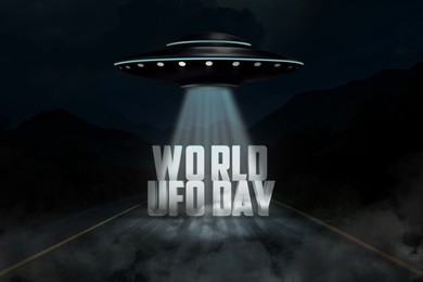 World UFO Day. Alien spaceship emitting light beam with words over highway at night