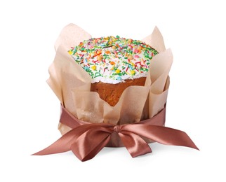 Traditional Easter cake with sprinkles wrapped in parchment paper with ribbon isolated on white