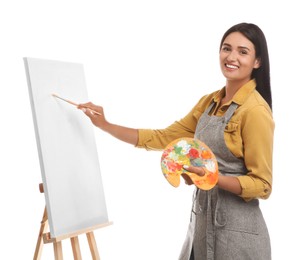 Young woman drawing on easel against white background