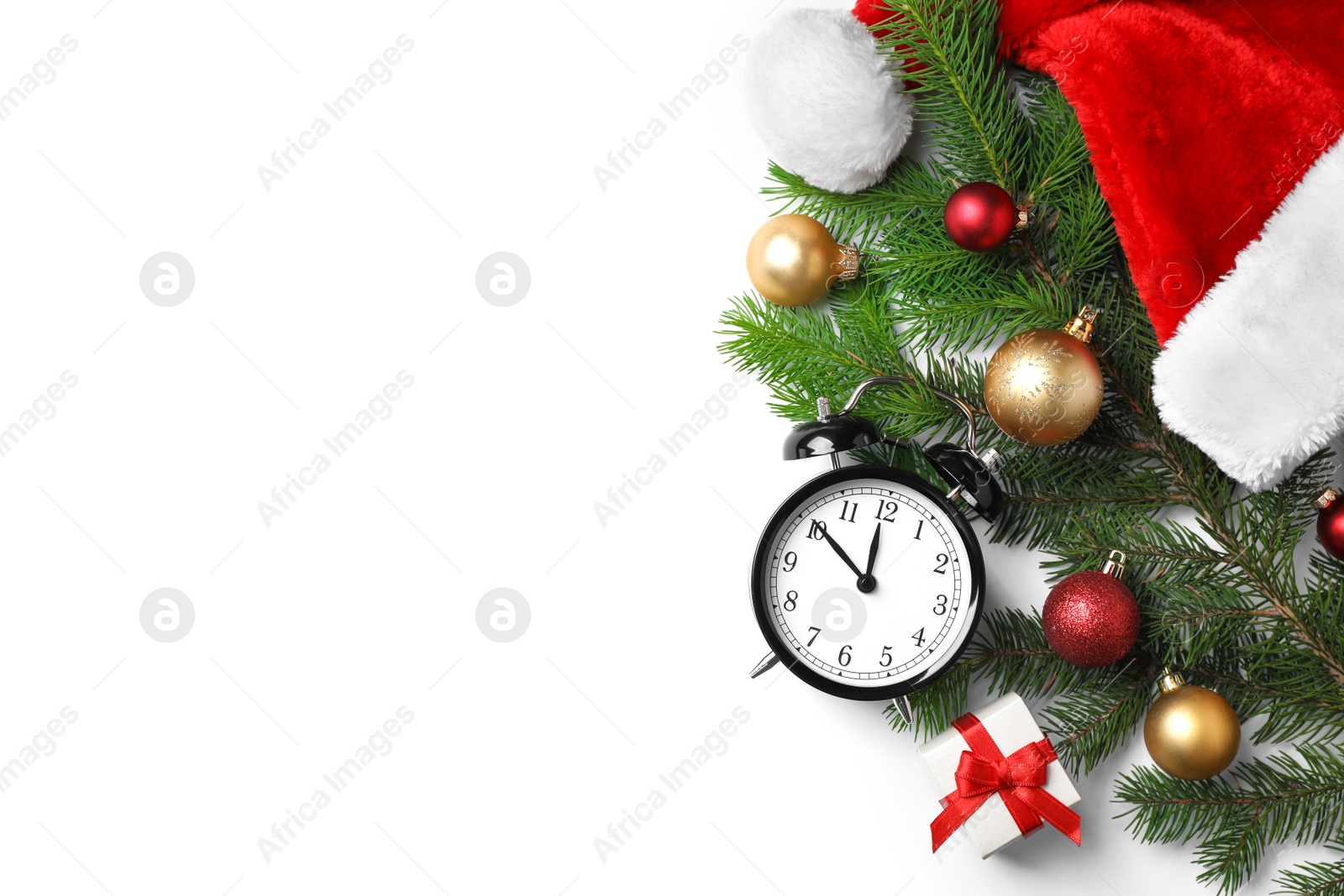 Photo of Retro alarm clock and different decor on white background, top view. Christmas countdown