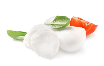 Photo of Delicious mozzarella, tomato and basil leaves on white background