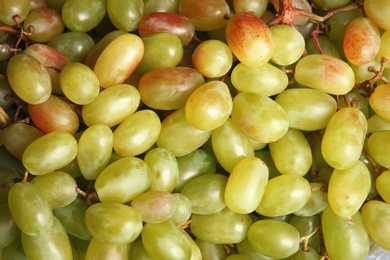 Photo of Fresh ripe juicy grapes as background, closeup