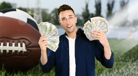 Image of Sports betting. Happy winner holding cash fans. Stadium with different balls on background