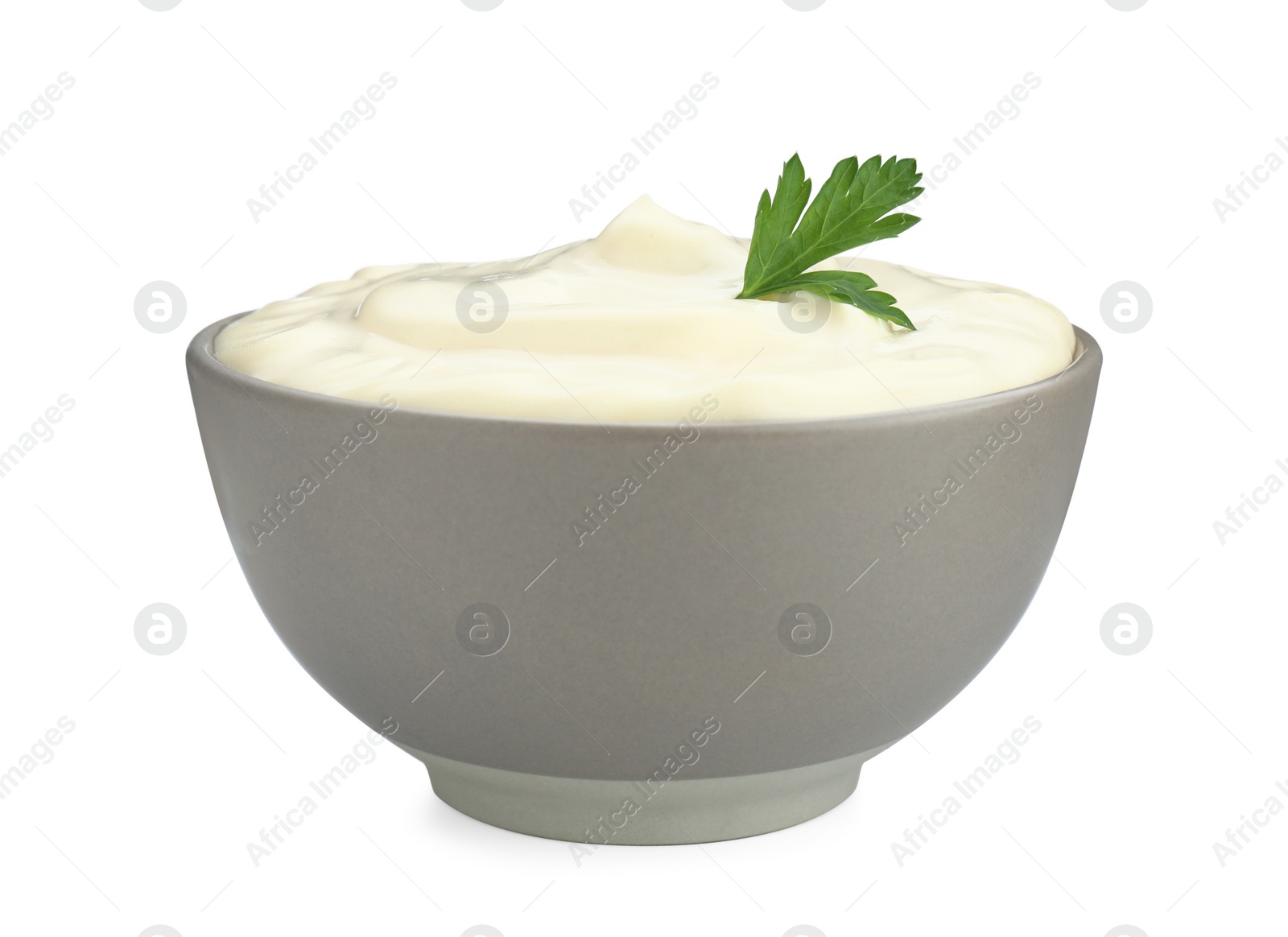 Photo of Tasty mayonnaise and parsley in bowl isolated on white