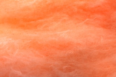 Photo of Orange cotton candy as background, closeup view