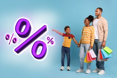 Image of Discount offer. Family with shopping bags looking at percent signs on light blue background