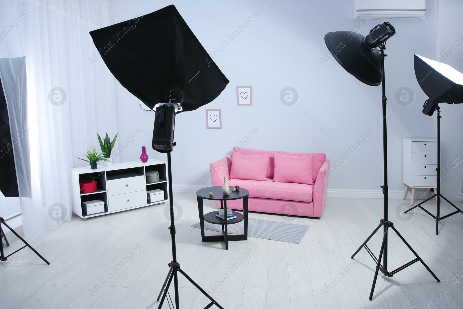 Photo of Example of living room interior design and professional equipment in photo studio